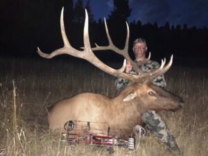 An Elk Ridge Outfitters guest poses with an Elk