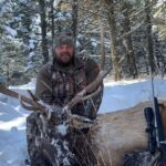 An Elk Ridge Outfitters guest poses with an Antelope he's taken down